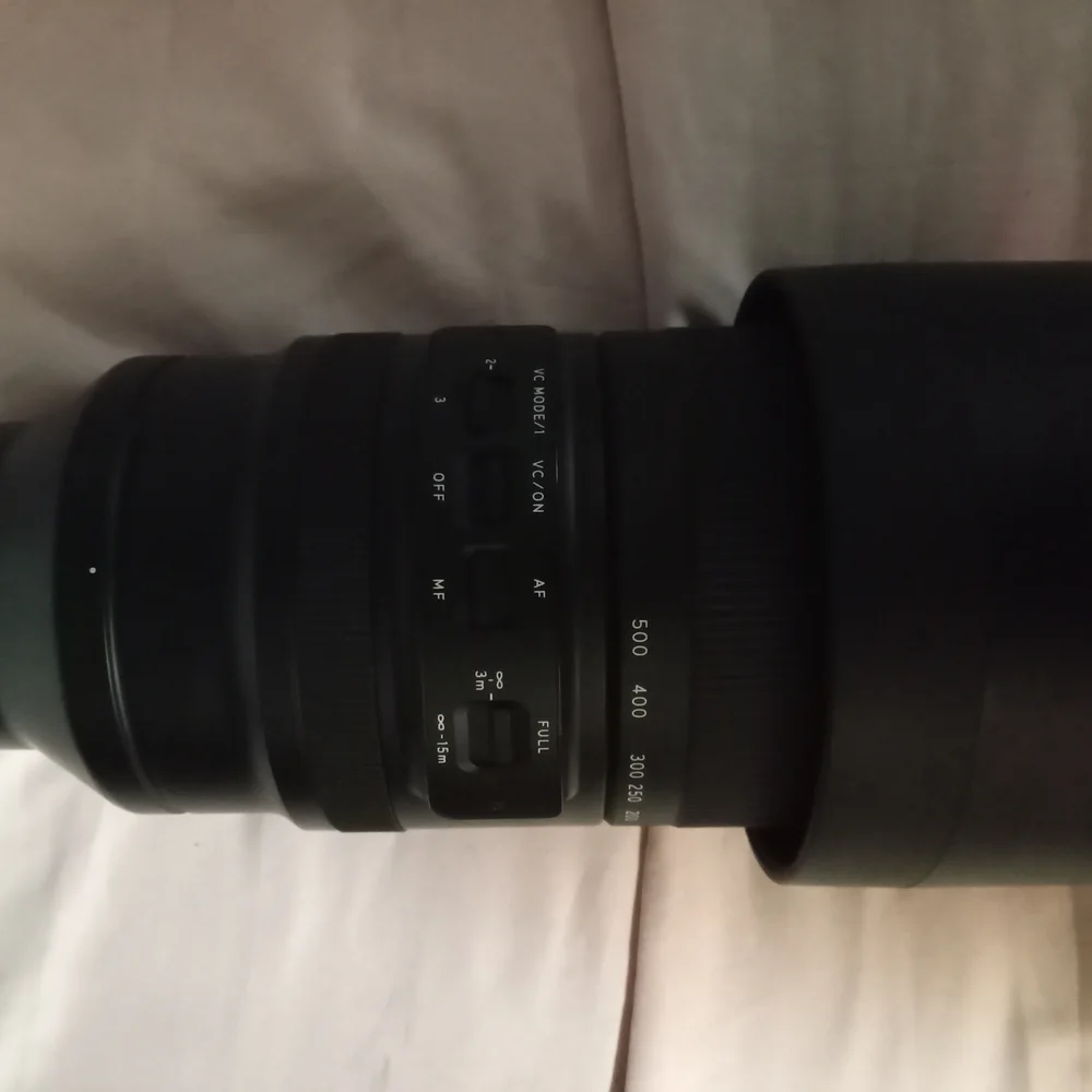 Black Telephoto Zoom Lens with Textured Focusing Ring and Robust Construction
